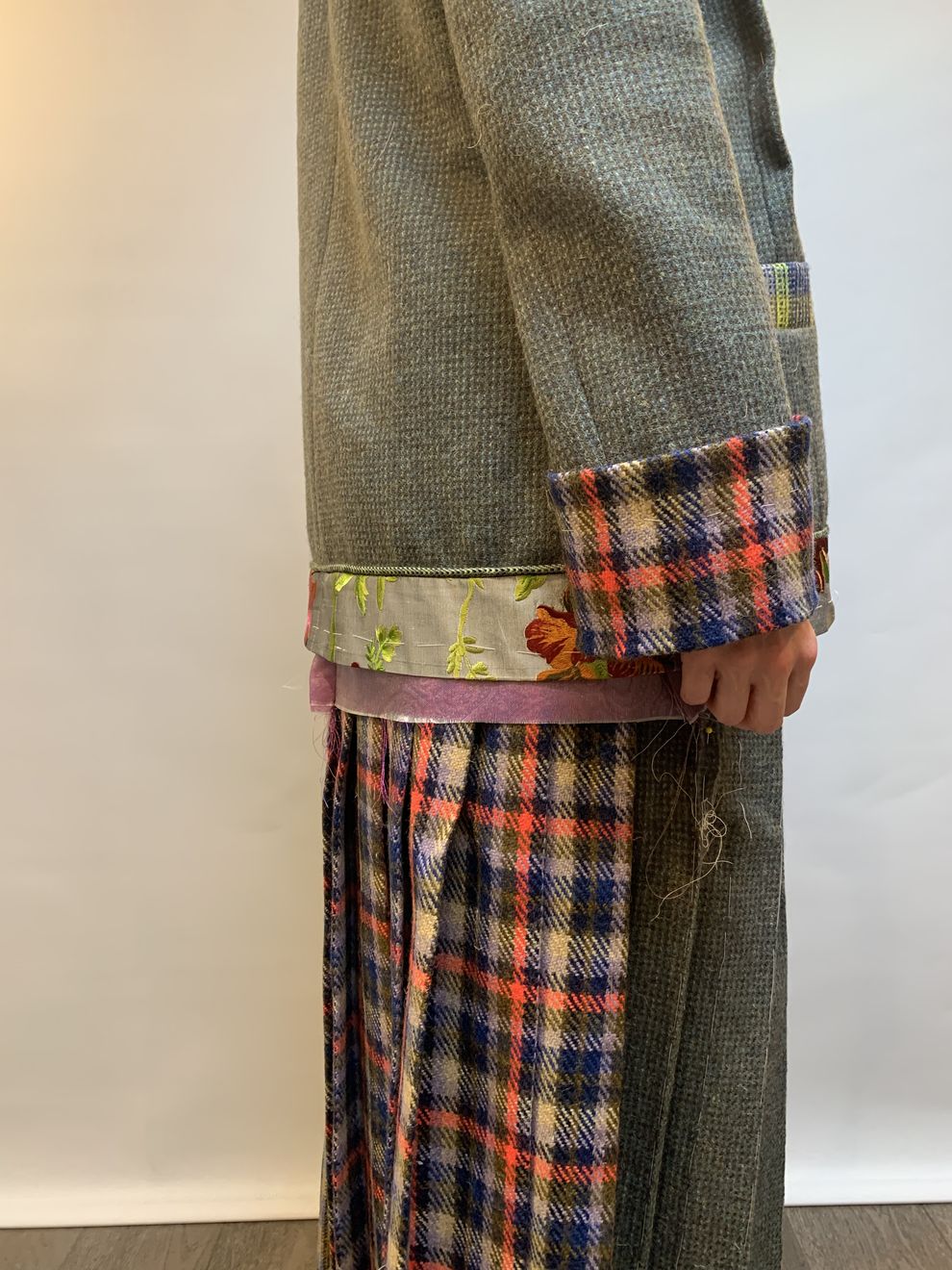 A tartan-faced cuff detail on a tweed jacket