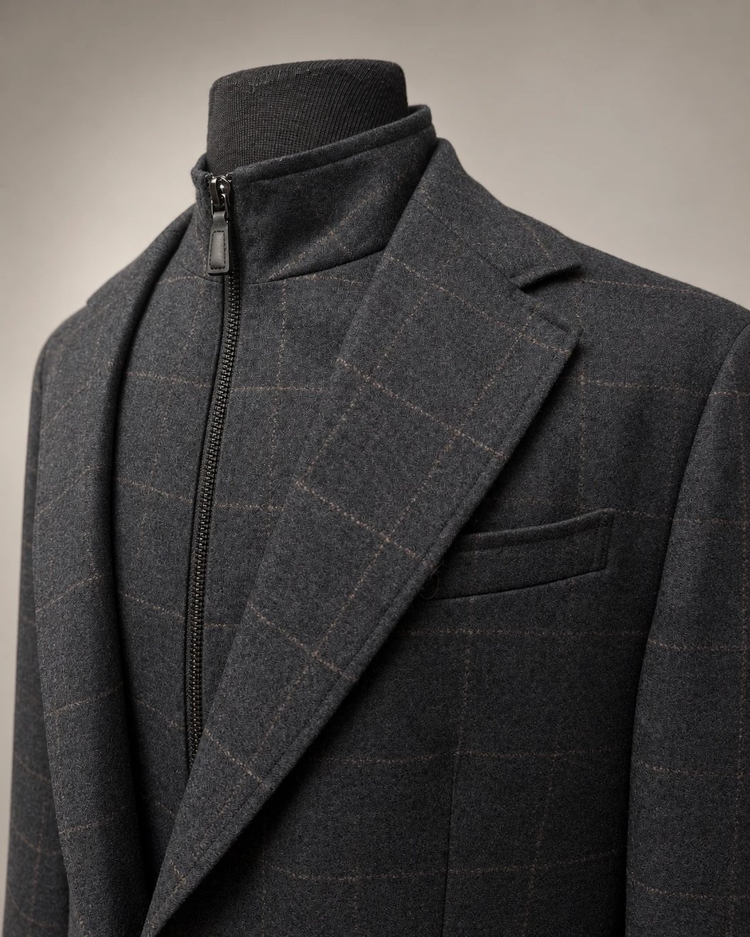 A grey windowpane jacket with a removable zip insert at the collar