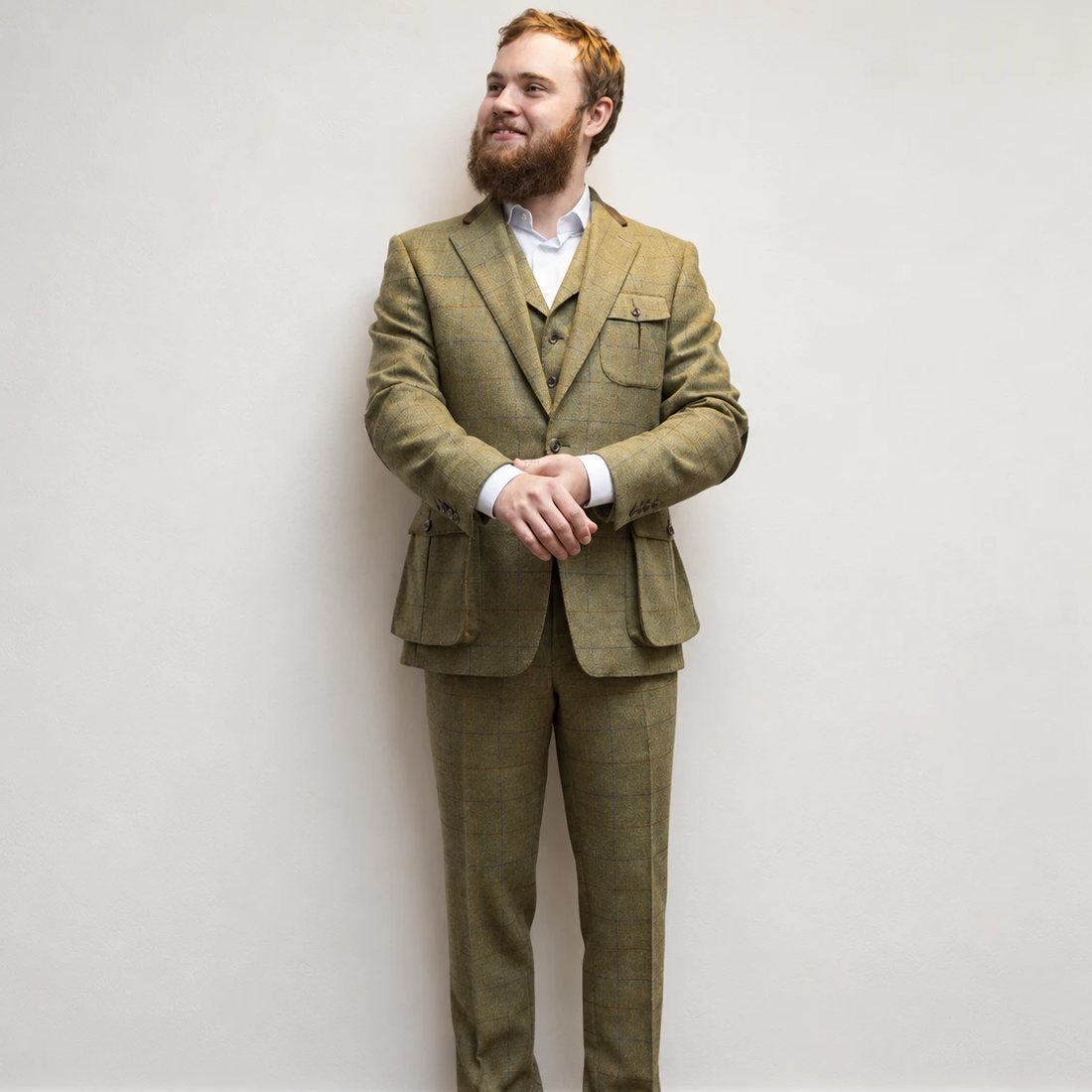 A client in his finished tweed windowpane three-piece suit