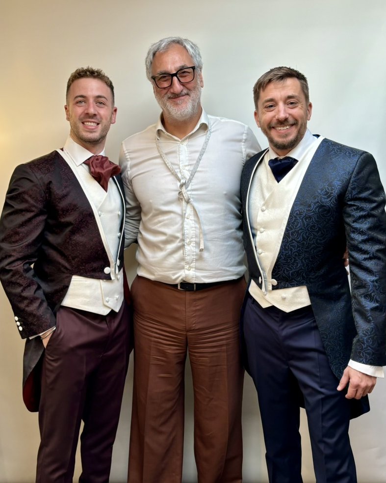 Orhan with two grooms in their burgundy and navy brocade tailcoats with ivory waistcoats